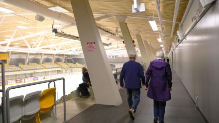 Two people walking on the walking track