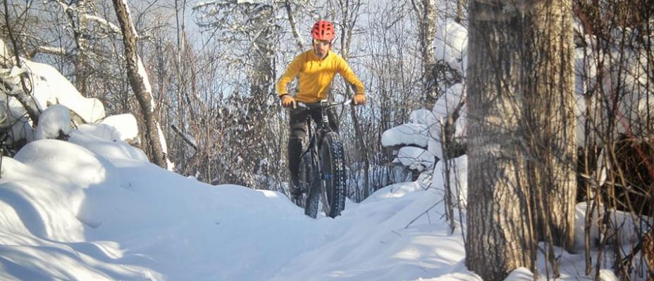 man snow biking